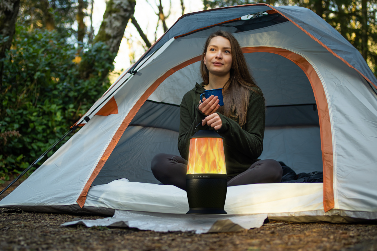 Woman camping using OKKO Ember Portable Bluetooth Speaker