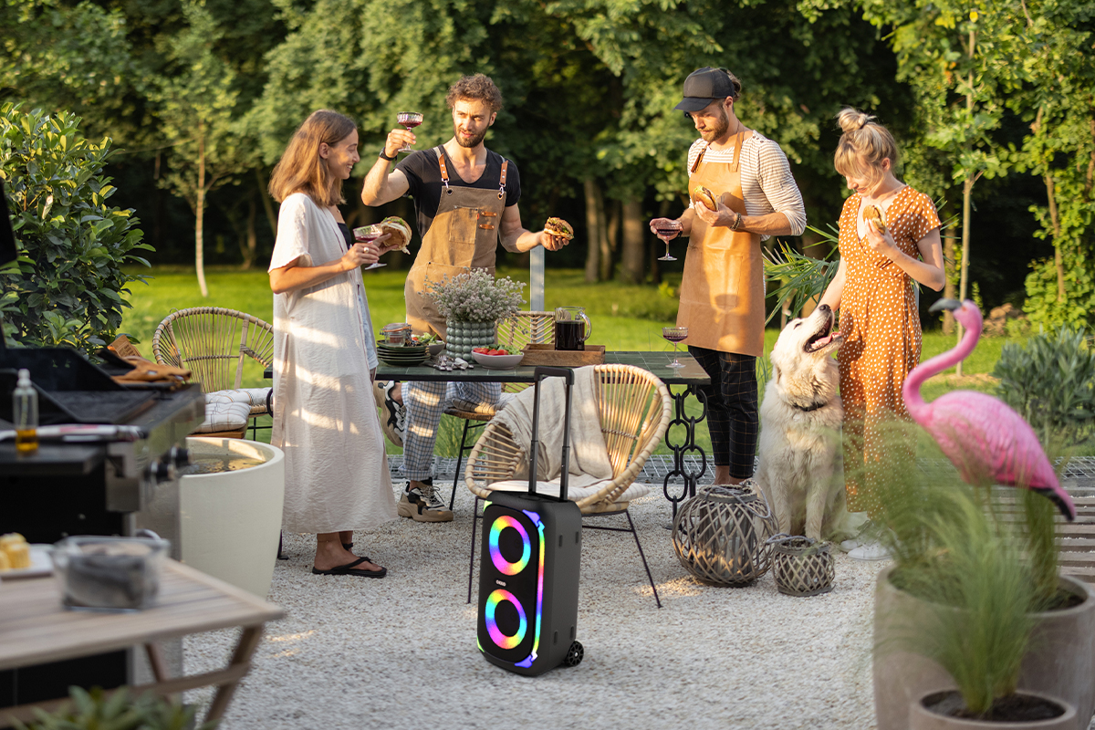 Group of friends using OKKO Sonic Bass speaker outside