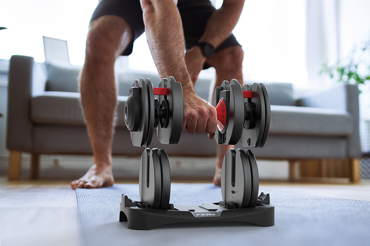 Man using FitRx SmartBell Adjustable Dumbbells