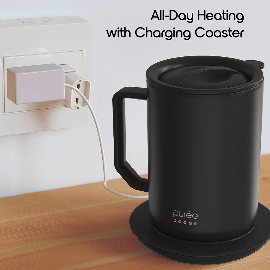 Purée warming mug plugged into a wall