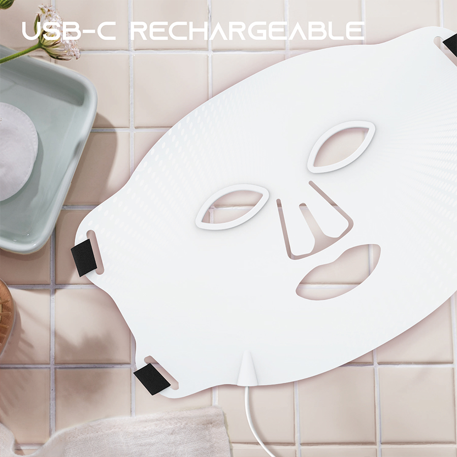 SLF LED Face Mask on bathroom counter; mask is USB-C rechargeable