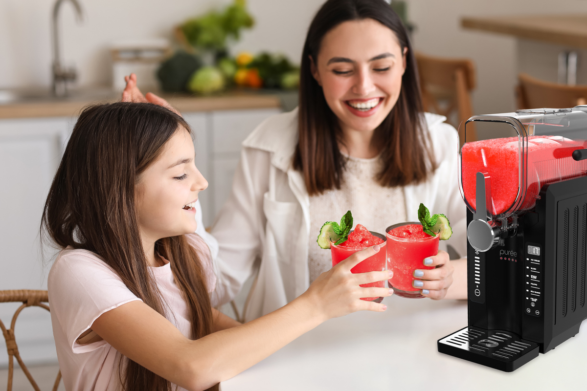Parent and child using Purée slushy machine
