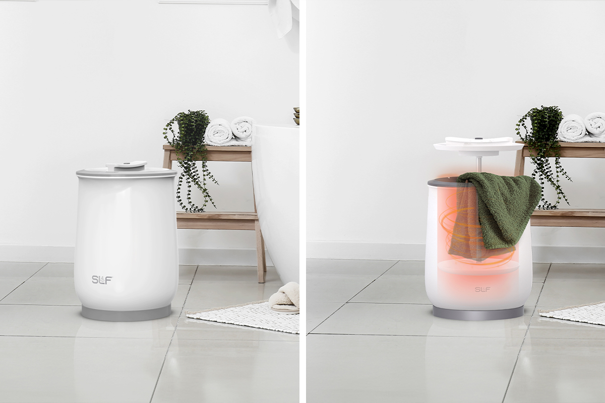 Close-up of fluffy towels being placed into the large-capacity SLF towel warmer.